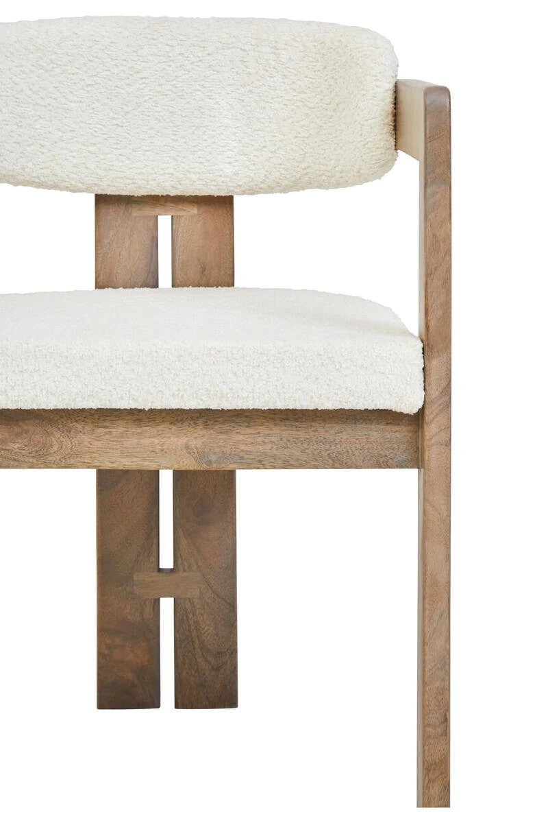 Close view of the Hawthorn Grey Dining Chair front, showing the bouclé seat and the split mango wood back legs.