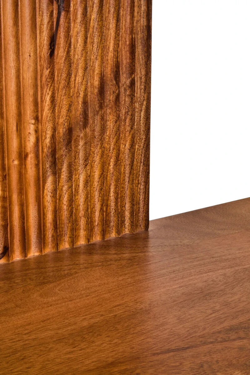 Close-up of the vertical reeding and mango wood grain on the Hawthorn shelf unit's centre panel.