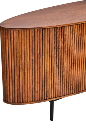 Close view of the curved end of the Hawthorn Oval Sideboard, showing the reeded mango wood and oval top.