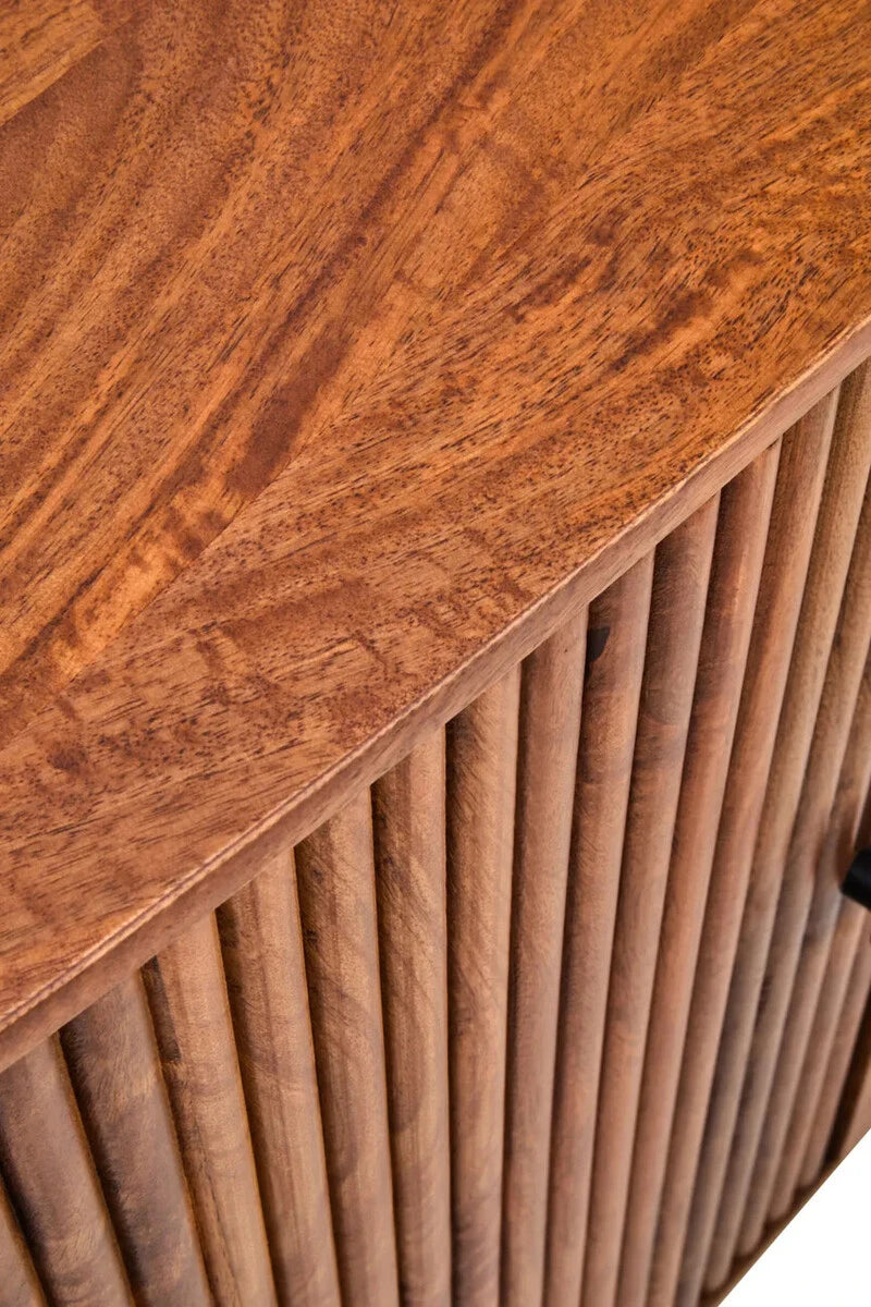 Close-up of the mango wood grain on the top of the Hawthorn Oval Sideboard above the reeded front.