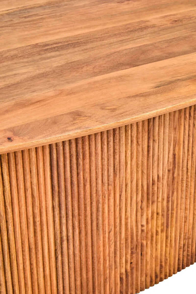 Close-up of the edge of the Hawthorn dining table top above the fluted mango wood base.