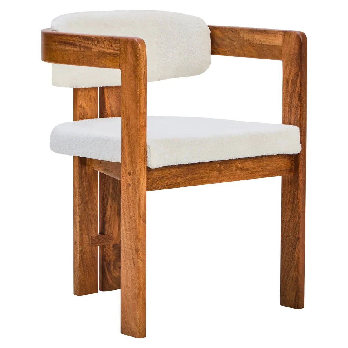 The Hawthorn Dining Chair from a three-quarter angle, with its mango wood frame wrapping around to form slim armrests.