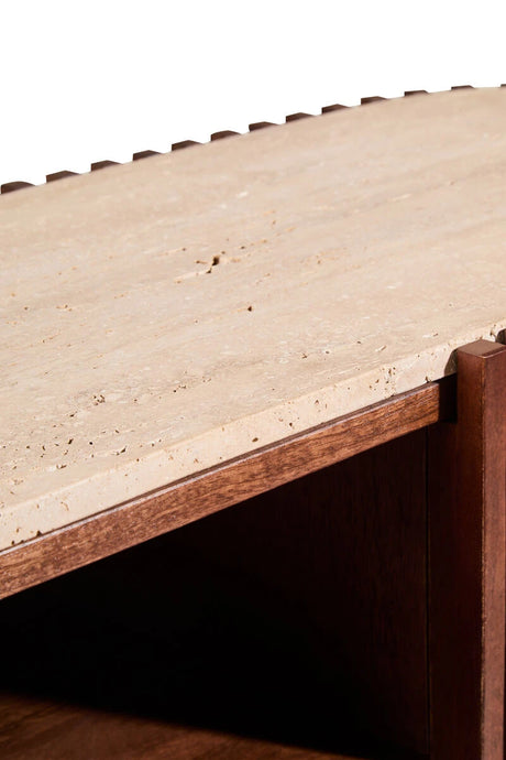 Close-up of the travertine top and shelf inside the Solmere media unit