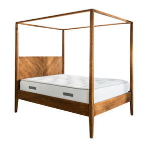 The Ashcombe Four Poster King Size Bed in reclaimed teak, showing the open canopy, tapered posts and chevron-pattern headboard.