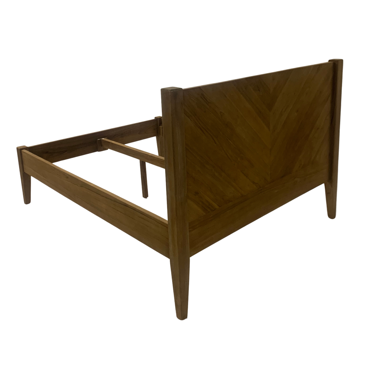The Ashcombe King Size Bed frame from behind, showing the back of the reclaimed teak headboard and tapered legs.