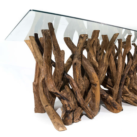 Glass-top dining table with natural wood base on a white background