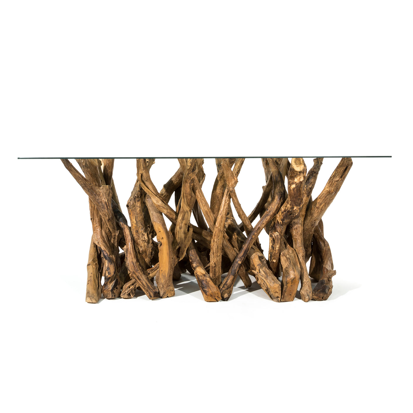 Teak root dining table with a glass top on a white background