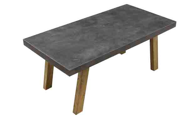 A rectangular concrete table with a dark grey top and four angled light brown wooden legs, shown on a plain white background.