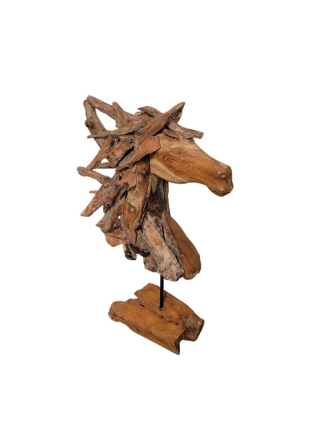 Wooden horse head sculpture on a stand with a white background