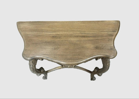 A rustic console table with a weathered light brown wood top and ornate silver metal legs, shown against a plain light gray background.