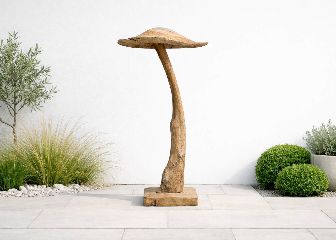 Wooden mushroom-shaped ornament in a garden setting with plants and a white wall.