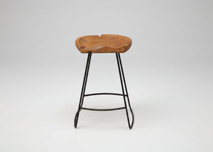 Wooden stool with black metal legs on a white background
