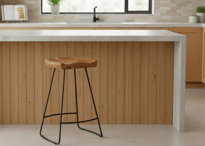 Wooden bar stool with black legs in a kitchen setting