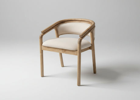 A modern accent chair with a curved light oak wood frame and cream-colored fabric upholstery on the seat and backrest, shown against a neutral light grey studio background.