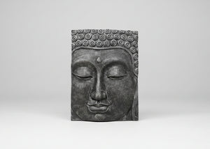A rectangular dark grey Buddha head wall plaque with detailed sculpted curls on the hair and a serene closed face, shown against a neutral light grey background.