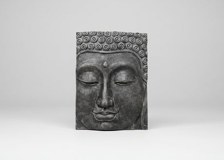 A rectangular dark grey Buddha head wall plaque with detailed sculpted curls on the hair and a serene closed face, shown against a neutral light grey background.
