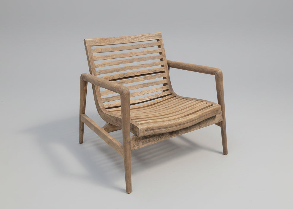 Wooden chair with slatted design on a grey background