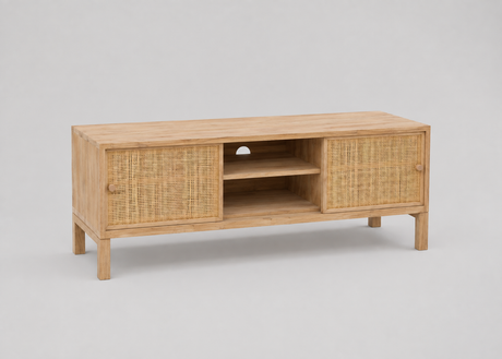 A light natural wood TV stand or media console with woven rattan panel doors and an open centre shelf, photographed on a plain light grey studio background.