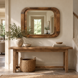 Bala Wooden Rectangle Hammer Design Mirror hung above a rustic wooden console table with a stone vase of olive branches and a woven basket