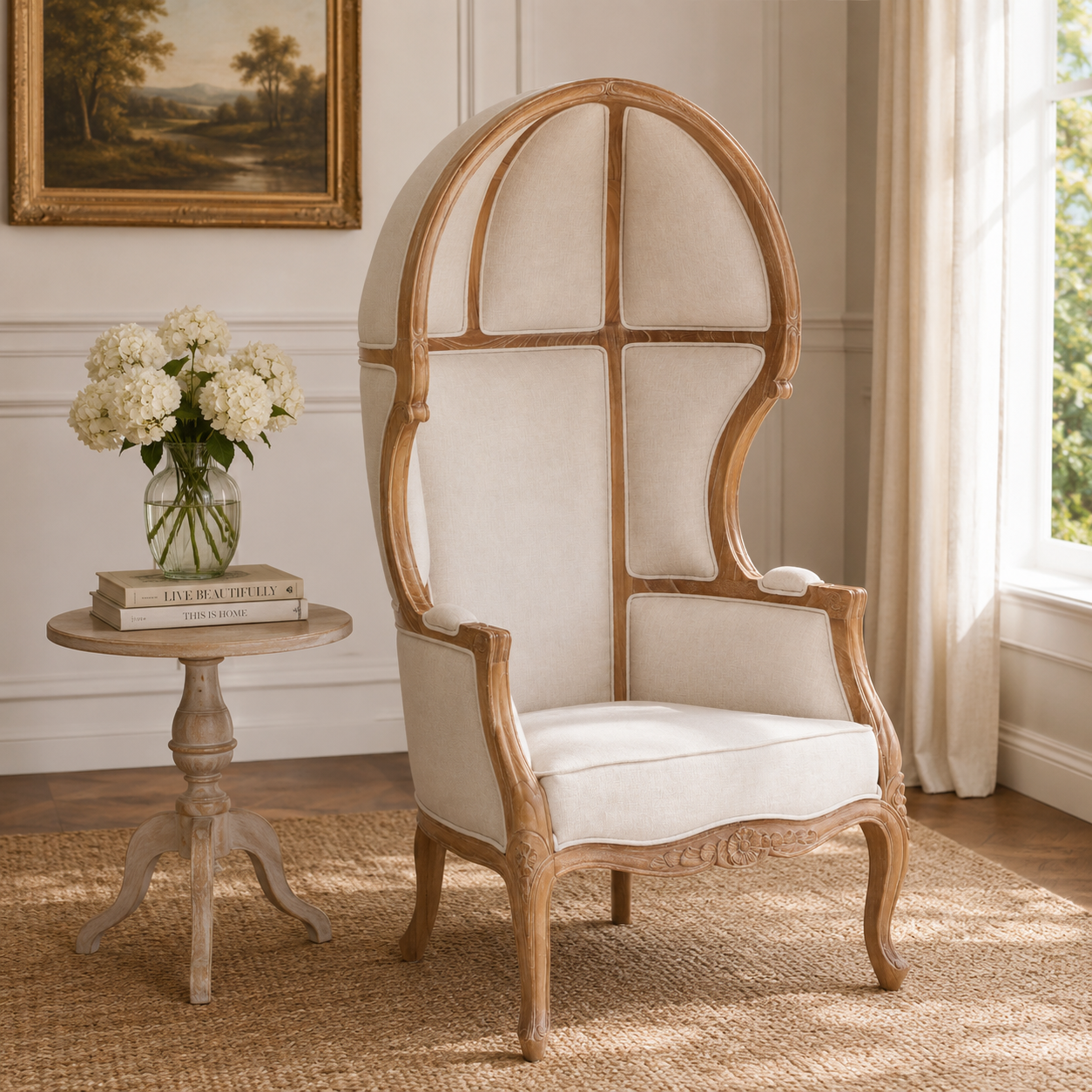 Wooden chair with cream cushion in a room with a side table and flowers.