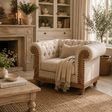 Cozy living room with a beige armchair, fireplace, and decorative elements.