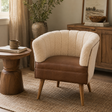 Brown buffalo leather chair with cream boucle backrest in a cosy room setting.
