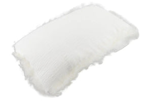 Rectangular White Linen Cushion With Sheepskin Trim shown at an angle, with its crinkled linen front and fluffy sheepskin trim