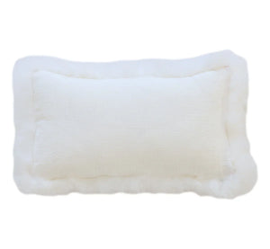 Rectangular White Linen Cushion With Sheepskin Trim in crinkled white linen with a sheepskin border, on a white background