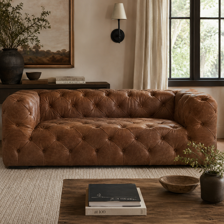 Brown leather sofa in a living room with decor elements.