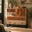 Folklore mango wood sideboard with cowhide drawer and black metal base, styled with a vase and bowls