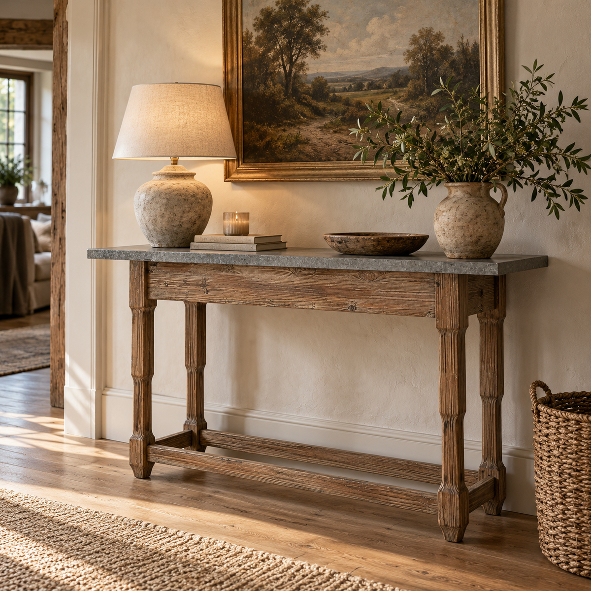 Hatherley antique wood console table with grey stone-effect top, styled with a table lamp and vase in a hallway