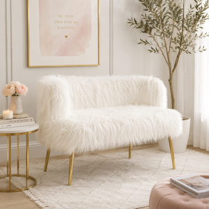 White fluffy sofa in a stylish living room with decor elements.