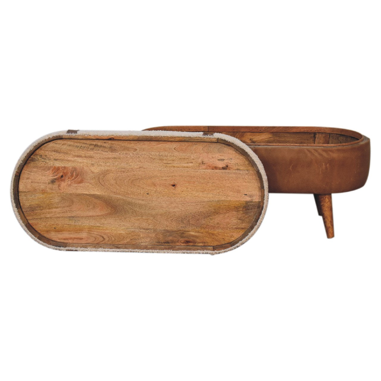 A beige boucle seat bench with brown buffalo leather straps, a wooden base with four legs and a removable top sitting against the side