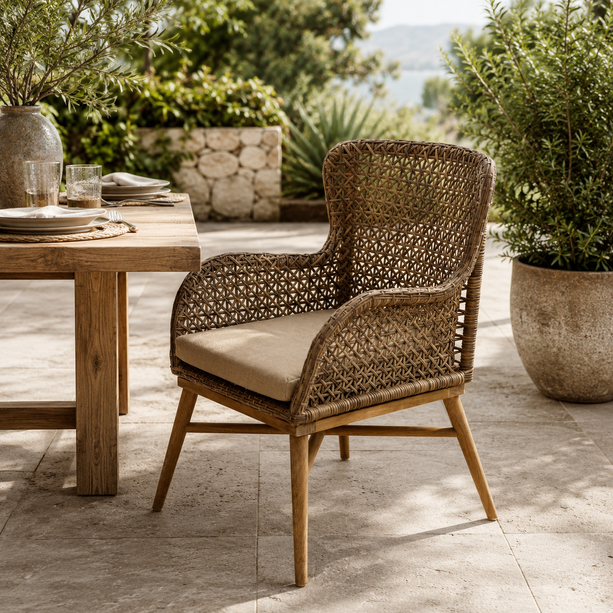 Woven outdoor dining chair with cushion by a wooden table outdoors