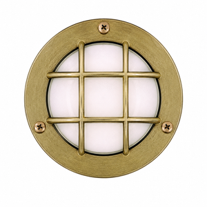 Round brass light fixture with grid design on a white background