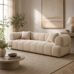 Cream linen sofa in a modern living room with neutral decor