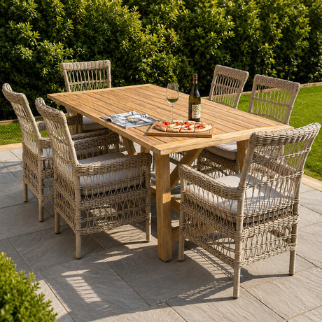 A large outdoor dining table made of acacia wood, accompanied by matching chairs with a woven design. The set is placed on an outdoor patio.