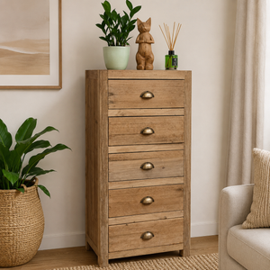 Wooden chest of drawers with decorative items in a living room setting
