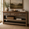 Rustic wooden sideboard with decorative items in a room with a painting on the wall.