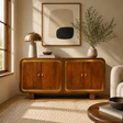 Wooden sideboard in a living room with decor elements