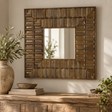 Sarana Tile Wooden Square Wall Mirror hung above a rustic wooden sideboard with a stone vase of olive branches, a wooden bowl and books