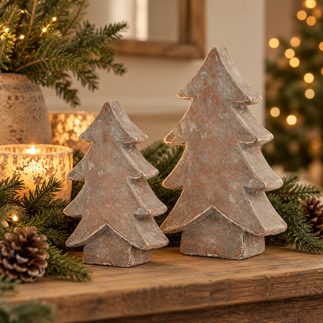 Two Siena Brown stone-effect ceramic trees on a rustic wooden mantel with candles, pinecones and pine sprigs