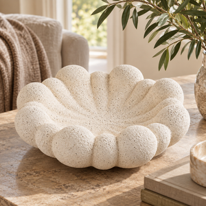 Soren Sandstone Effect Bubble Design Bowl styled on a natural stone table in a warm, neutral living room.