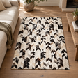 Vale Safira Geometric Cowhide Patchwork Rug on a wooden floor beside a cream sofa and rustic wooden coffee table