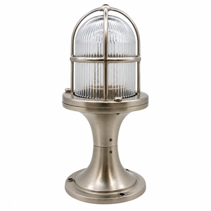 Industrial-style table lamp with a ribbed clear glass dome shade and a brushed metal base in a silver finish, shown on a plain white background.