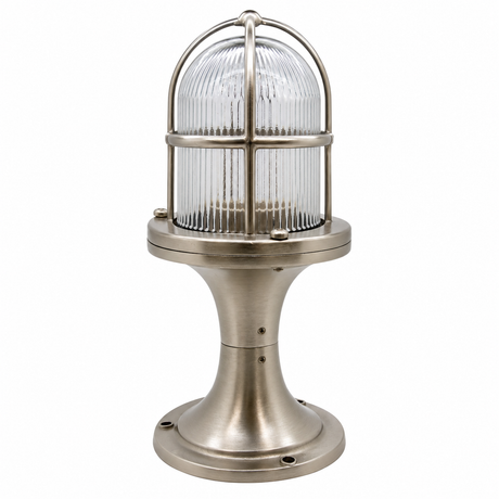 Industrial-style table lamp with a ribbed clear glass dome shade and a brushed metal base in a silver finish, shown on a plain white background.