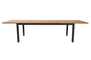 A rectangular outdoor dining table with a light brown teak wood slatted top and a black metal frame with four legs, shown against a plain white background.