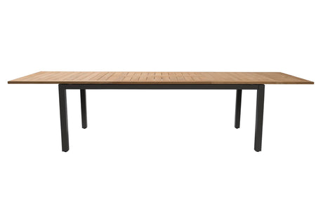 A rectangular outdoor dining table with a light brown teak wood slatted top and a black metal frame with four legs, shown against a plain white background.