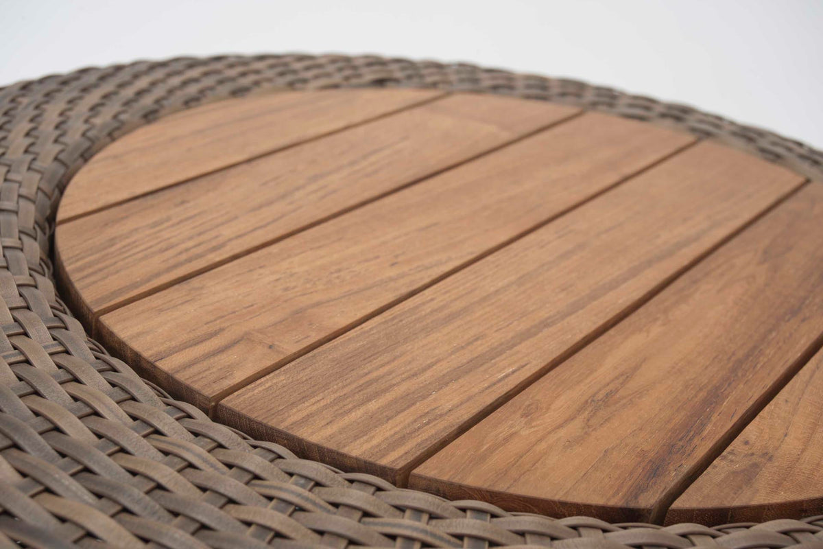 Round wooden table top with woven edge on a white background