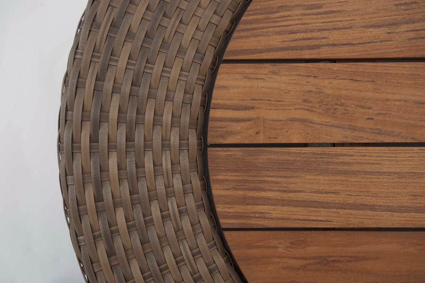 Close-up of a woven table top and wooden surface on a white background